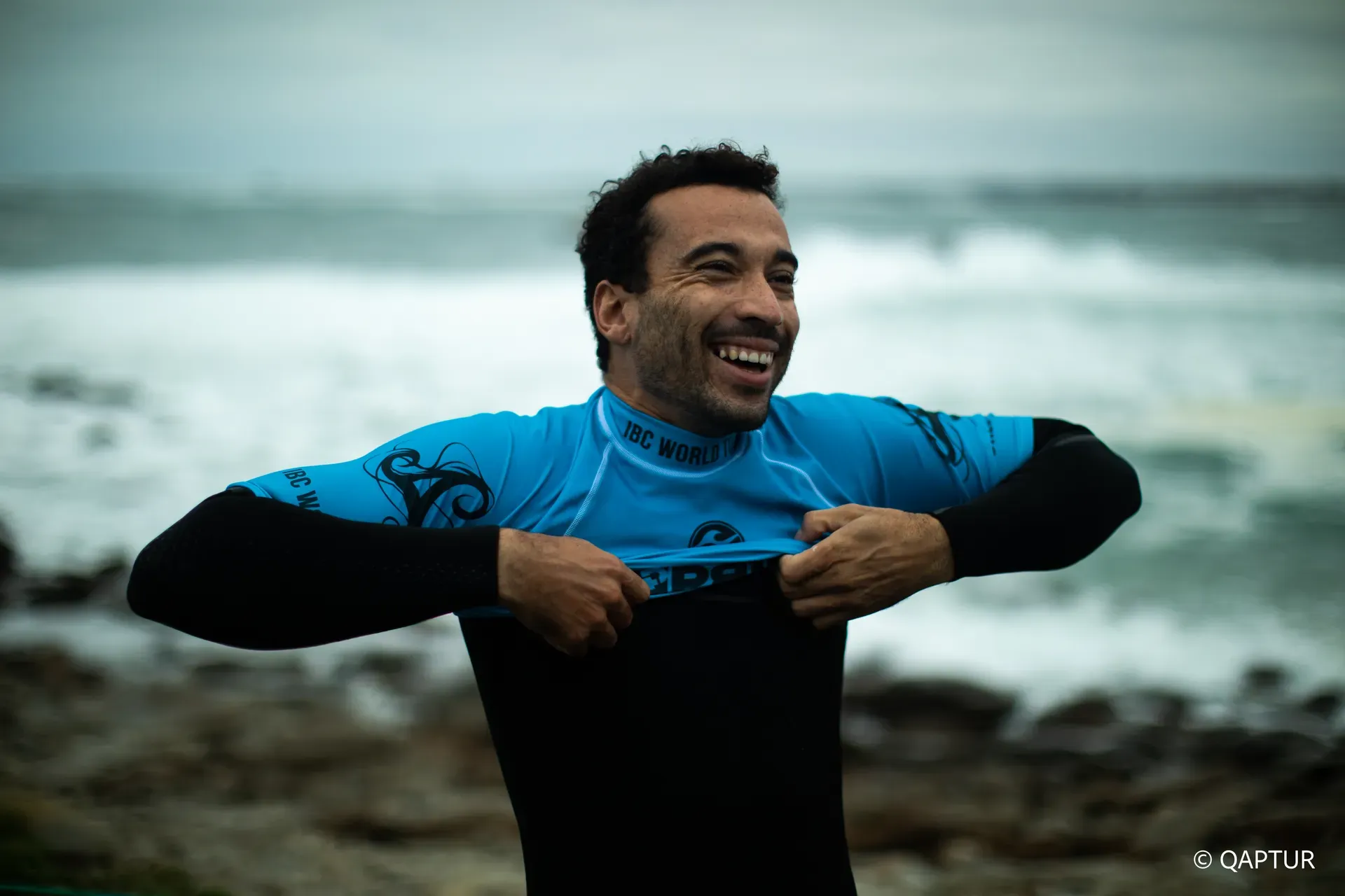 Derek Crater smiling by the ocean