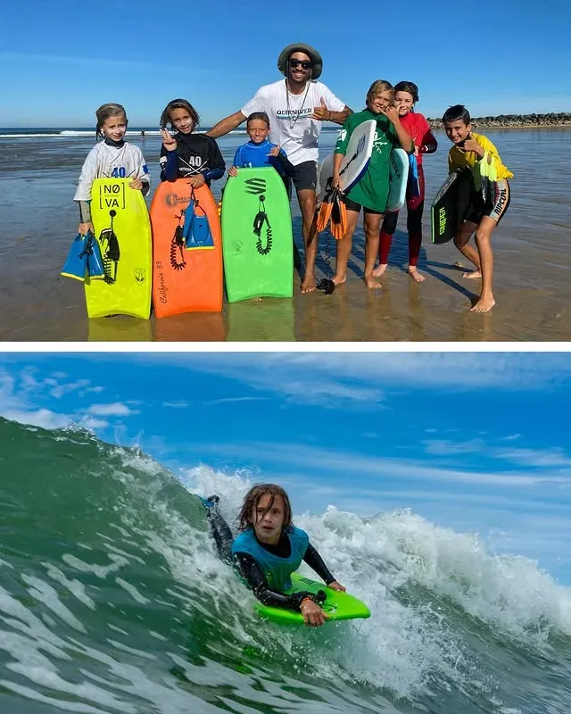 Derek Crater bodyboarding with a group of students at Capbreton